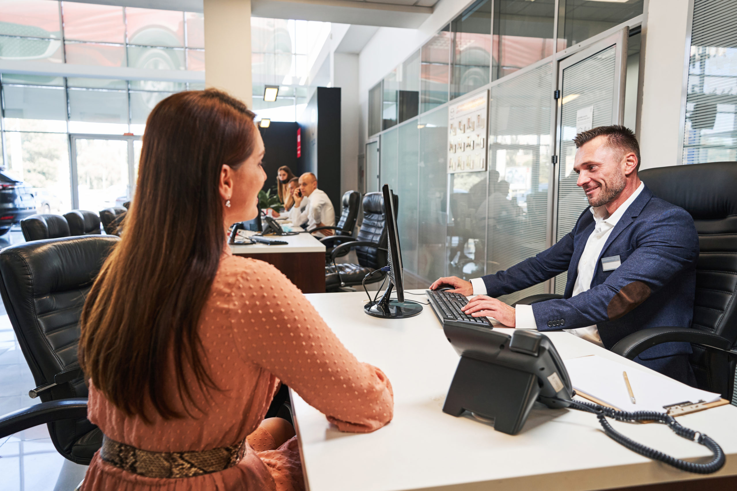 Friendly manager spending time with female customer
